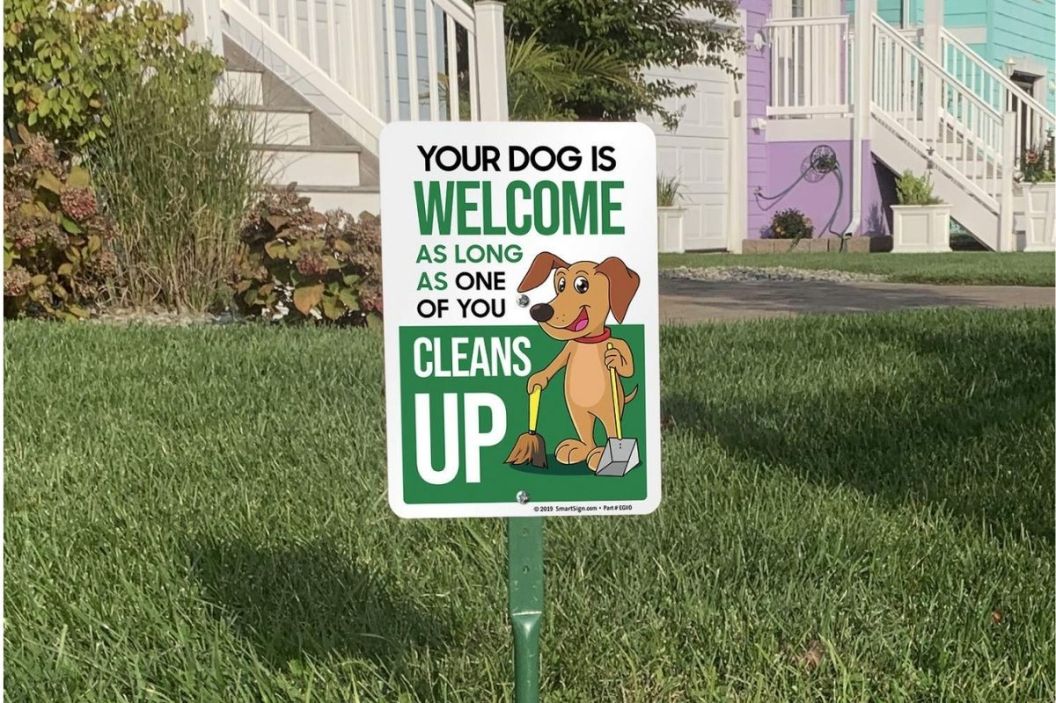 dog is welcome clean up sign