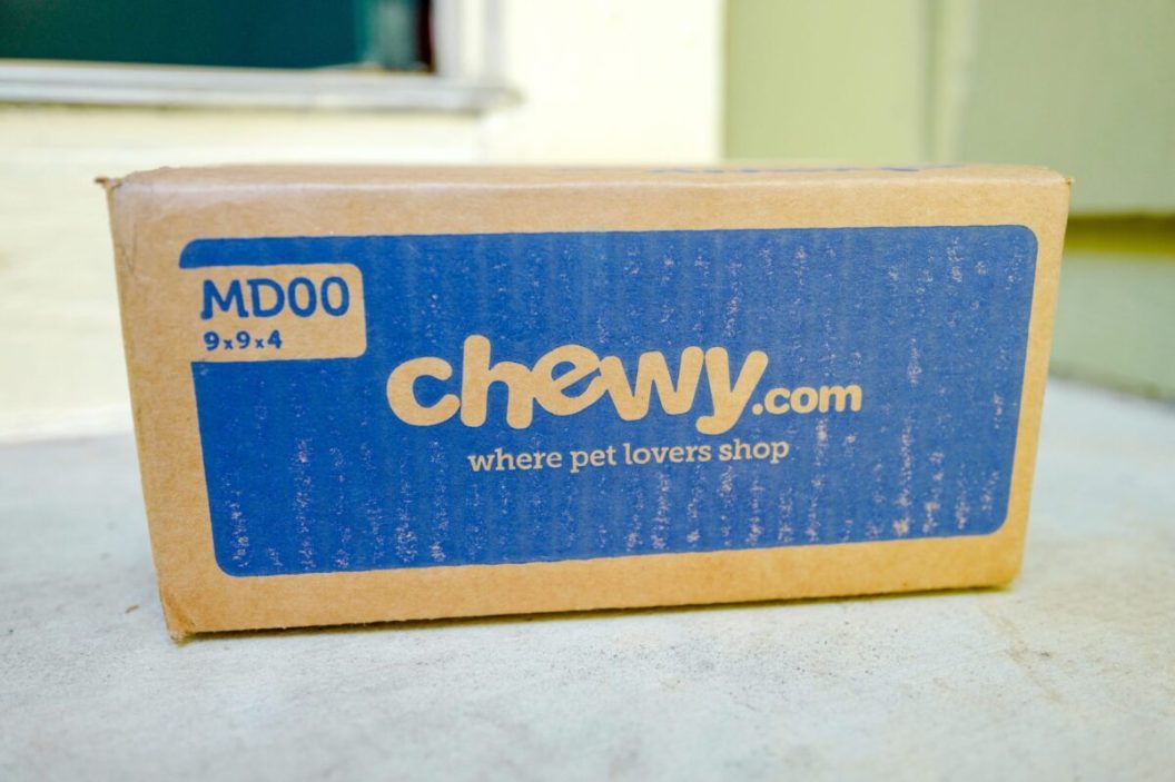 Close up of a Chewy.com box from pet-product online retailer Chewy, resting on a light-colored countertop